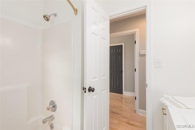 7313 Key Deer Cir, Midlothian, VA 23112 - bathroom featuring shower / bathtub combination, vanity, wood finished floors, and baseboards
