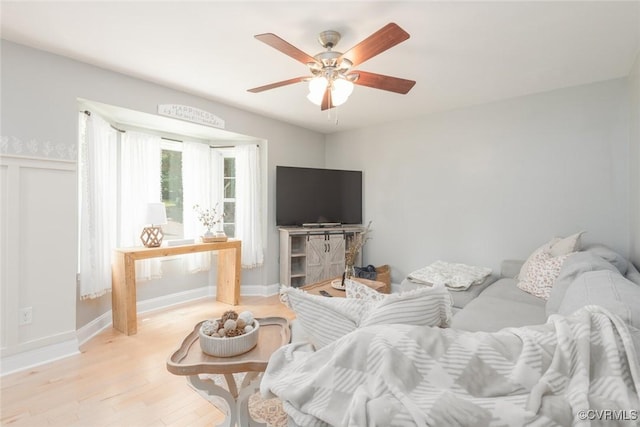 7313 Key Deer Cir, Midlothian, VA 23112 - living area featuring light wood-type flooring, ceiling fan, and baseboards