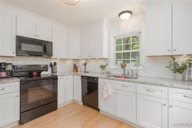 7313 Key Deer Cir, Midlothian, VA 23112 - kitchen with black appliances, a sink, white cabinetry, light wood finished floors, and backsplash