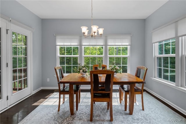 1012 Water Beech Rd, Midlothian, VA 23114 - dining room with plenty of natural light, a chandelier, wood finished floors, and baseboards