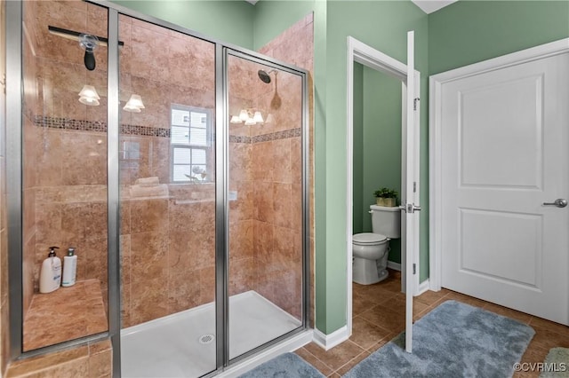 1012 Water Beech Rd, Midlothian, VA 23114 - bathroom featuring a shower stall, toilet, tile patterned floors, and baseboards