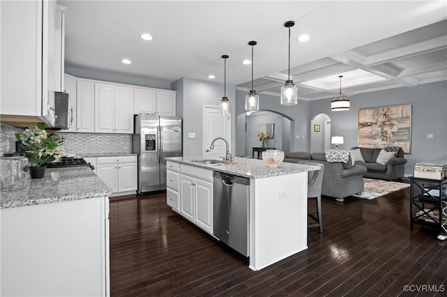 1012 Water Beech Rd, Midlothian, VA 23114 - kitchen with appliances with stainless steel finishes, a sink, arched walkways, coffered ceiling, and beam ceiling