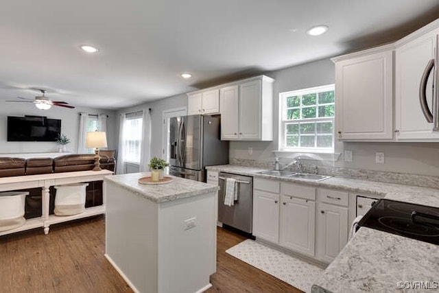 328 Peregrine Pl, Louisa, VA 23093 - kitchen with appliances with stainless steel finishes, a center island, white cabinetry, and recessed lighting