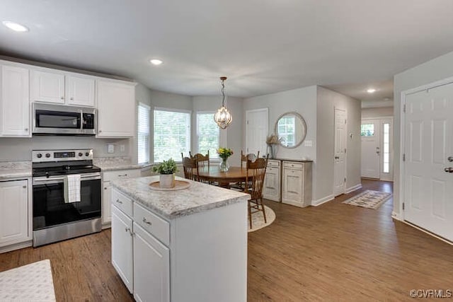 328 Peregrine Pl, Louisa, VA 23093 - kitchen featuring stainless steel appliances, white cabinetry, recessed lighting, light wood-type flooring, and a kitchen island