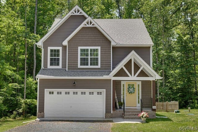 328 Peregrine Pl, Louisa, VA 23093 - craftsman-style house with gravel driveway, a garage, a shingled roof, and a front lawn