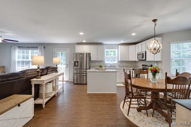 328 Peregrine Pl, Louisa, VA 23093 - dining space featuring dark wood-type flooring, a chandelier, a ceiling fan, and recessed lighting