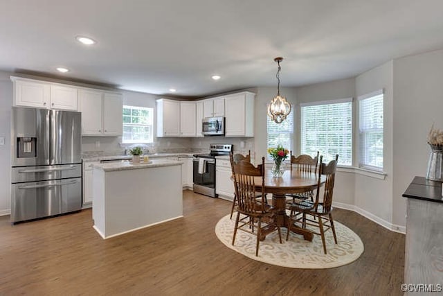 328 Peregrine Pl, Louisa, VA 23093 - kitchen featuring stainless steel appliances, white cabinets, dark wood finished floors, and recessed lighting