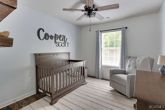328 Peregrine Pl, Louisa, VA 23093 - bedroom with wood finished floors, a nursery area, and ceiling fan