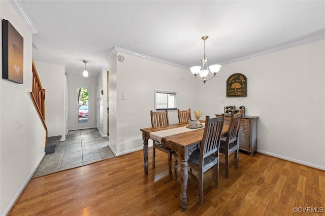 11605 E Briar Patch Dr, Midlothian, VA 23113 - dining area with a chandelier, wood finished floors, baseboards, and crown molding