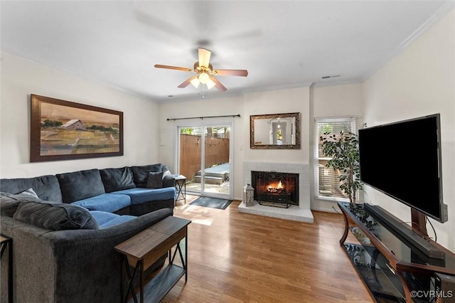 11605 E Briar Patch Dr, Midlothian, VA 23113 - living area with a ceiling fan, wood finished floors, a fireplace, and ornamental molding