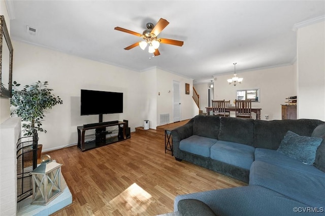 11605 E Briar Patch Dr, Midlothian, VA 23113 - living area featuring a chandelier, ornamental molding, wood finished floors, a ceiling fan, and stairway