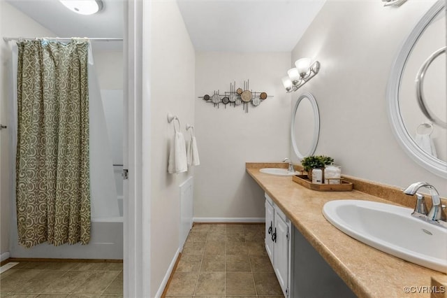 11605 E Briar Patch Dr, Midlothian, VA 23113 - bathroom featuring double vanity, shower / bath combination with curtain, tile patterned floors, and baseboards