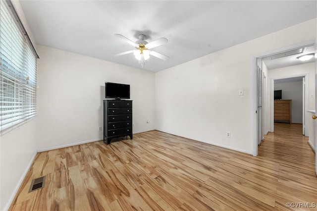 11605 E Briar Patch Dr, Midlothian, VA 23113 - empty room featuring light wood-type flooring, a ceiling fan, and baseboards