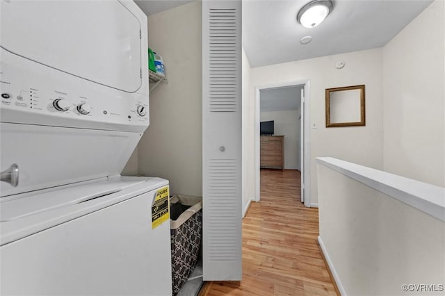 11605 E Briar Patch Dr, Midlothian, VA 23113 - laundry room with estacked washer and dryer, light wood finished floors, and baseboards