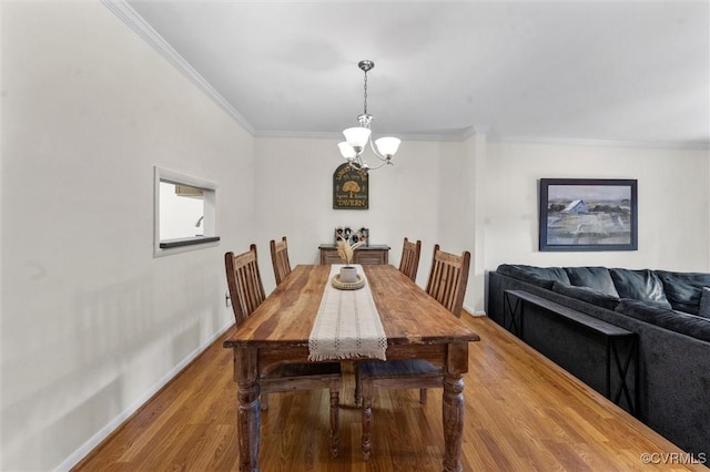 11605 E Briar Patch Dr, Midlothian, VA 23113 - dining room featuring a chandelier, ornamental molding, wood finished floors, and baseboards