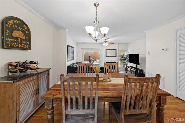 11605 E Briar Patch Dr, Midlothian, VA 23113 - dining area featuring a chandelier, ornamental molding, ceiling fan, and wood finished floors