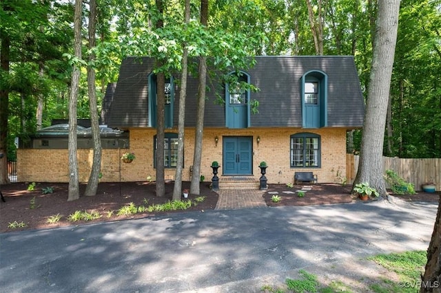 3301 E Princeton Rd, Petersburg, VA 23805 - view of front facade featuring french doors, brick siding, mansard roof, and a shingled roof