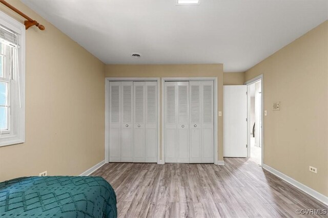 3301 E Princeton Rd, Petersburg, VA 23805 - bedroom with wood finished floors, multiple closets, and baseboards