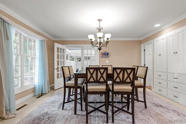 3301 E Princeton Rd, Petersburg, VA 23805 - dining space featuring ornamental molding, a chandelier, baseboards, and light wood-style flooring