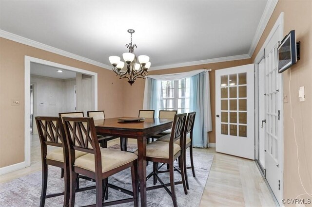 3301 E Princeton Rd, Petersburg, VA 23805 - dining space featuring a chandelier, light wood-style floors, ornamental molding, and baseboards