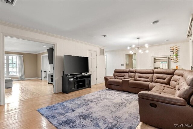 3301 E Princeton Rd, Petersburg, VA 23805 - living room with ornamental molding, light wood-style floors, a chandelier, and baseboards