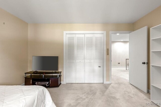 3301 E Princeton Rd, Petersburg, VA 23805 - bedroom featuring light carpet, baseboards, and a closet