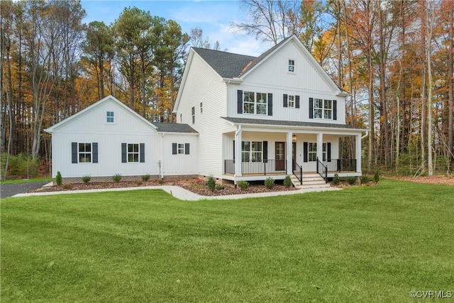 9027 Pine Hill Rd, Mechanicsville, VA 23116 - modern farmhouse style home featuring covered porch, a front lawn, and a shingled roof