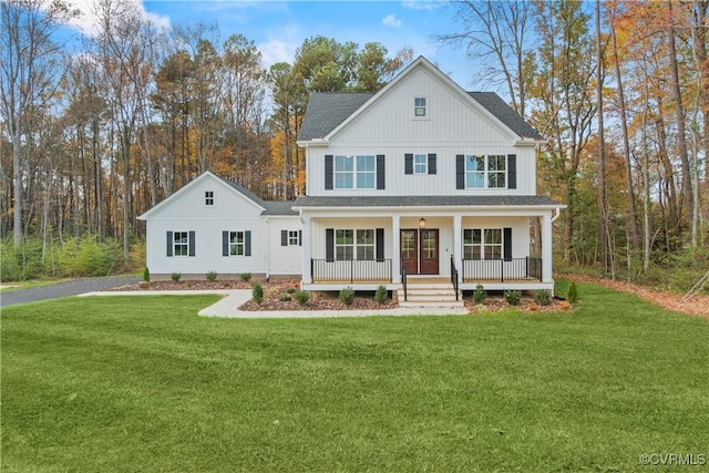 9027 Pine Hill Rd, Mechanicsville, VA 23116 - view of front facade featuring covered porch, a front yard, and a shingled roof