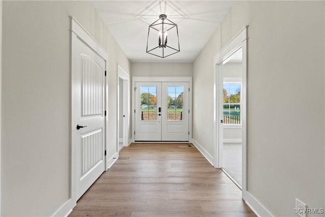 9027 Pine Hill Rd, Mechanicsville, VA 23116 - doorway with a chandelier, wood finished floors, french doors, and baseboards