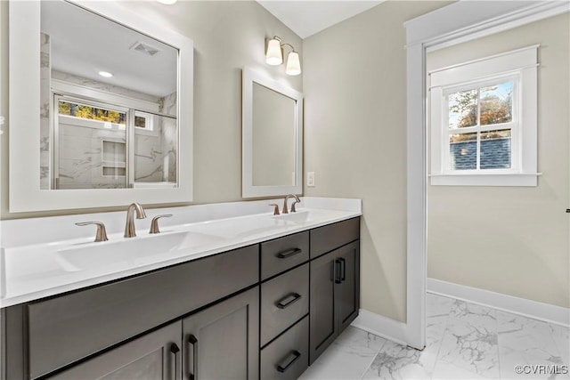 9027 Pine Hill Rd, Mechanicsville, VA 23116 - bathroom featuring healthy amount of natural light, double vanity, marble finish floors, and baseboards