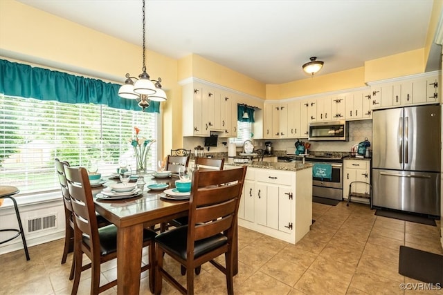 5120 Monza Ct, North Chesterfield, VA 23234 - dining area with healthy amount of natural light and light tile patterned floors