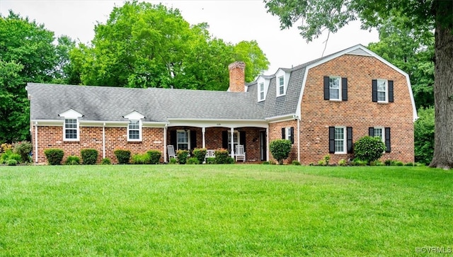 5120 Monza Ct, North Chesterfield, VA 23234 - colonial inspired home with a gambrel roof, brick siding, and a front lawn