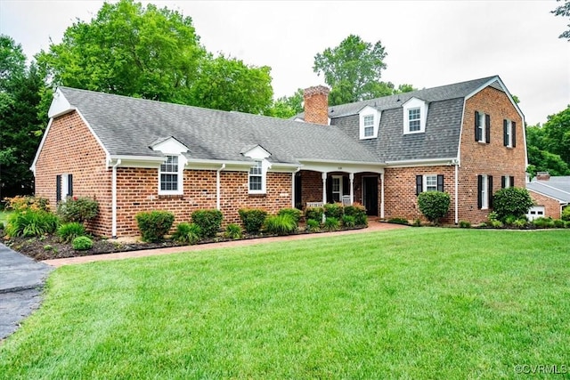 5120 Monza Ct, North Chesterfield, VA 23234 - view of front of property featuring a chimney, brick siding, a front lawn, and roof with shingles