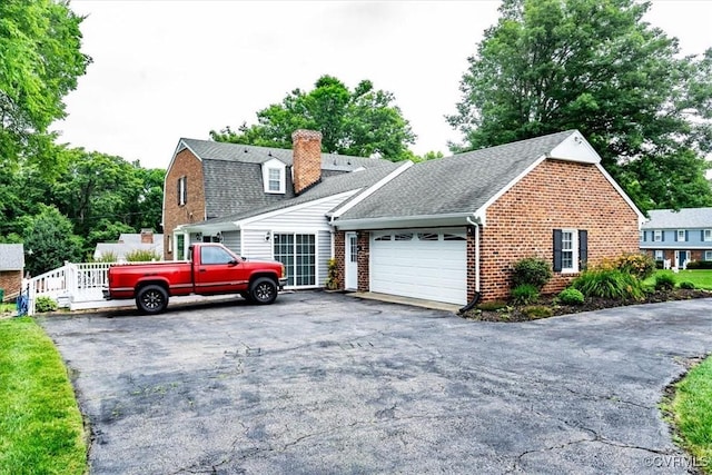 5120 Monza Ct, North Chesterfield, VA 23234 - view of front of property featuring brick siding, a garage, asphalt driveway, a chimney, and a gambrel roof