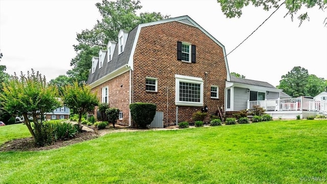 5120 Monza Ct, North Chesterfield, VA 23234 - back of property with a gambrel roof, brick siding, a lawn, and a wooden deck