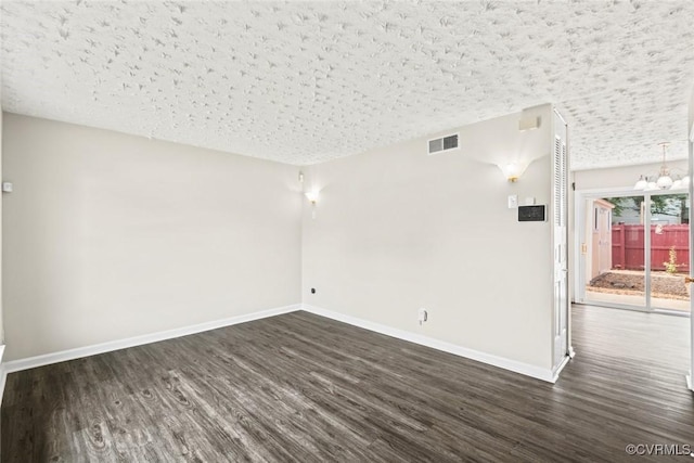 4706 Leadenhall Dr, Chesterfield, VA 23234 - empty room with dark wood-type flooring, a chandelier, baseboards, and a textured ceiling