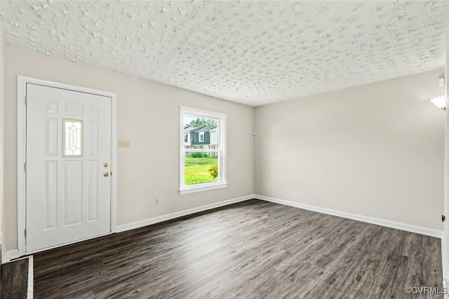 4706 Leadenhall Dr, Chesterfield, VA 23234 - foyer entrance with dark wood-style floors, baseboards, and a textured ceiling