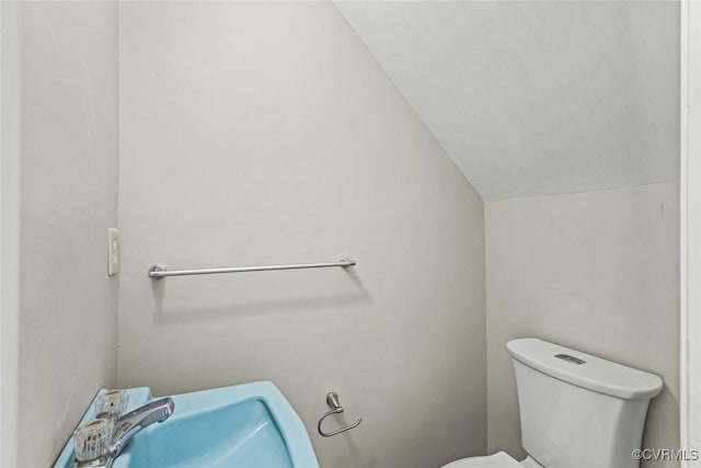 4706 Leadenhall Dr, Chesterfield, VA 23234 - bathroom featuring toilet, vaulted ceiling, and a sink