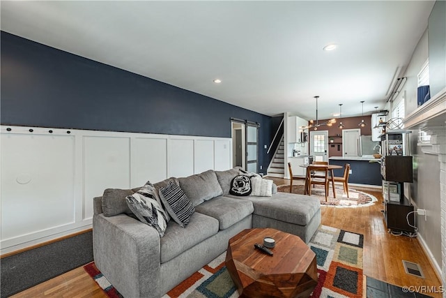 1815 Seddon Rd, Richmond, VA 23227 - living room with wood finished floors, stairway, and recessed lighting