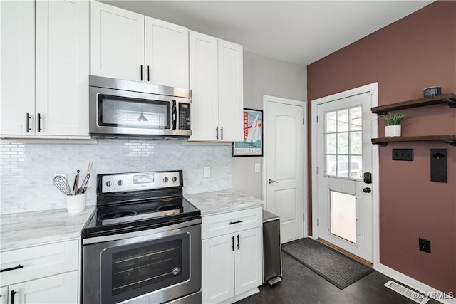 1815 Seddon Rd, Richmond, VA 23227 - kitchen featuring appliances with stainless steel finishes, white cabinets, and backsplash