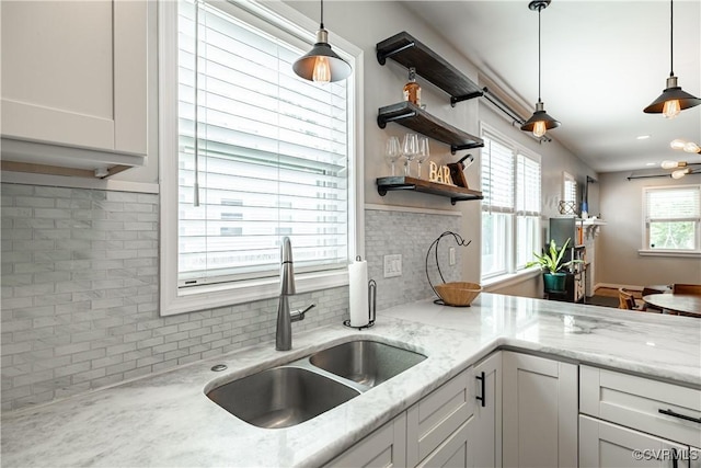 1815 Seddon Rd, Richmond, VA 23227 - kitchen featuring tasteful backsplash, pendant lighting, open shelves, and light stone countertops