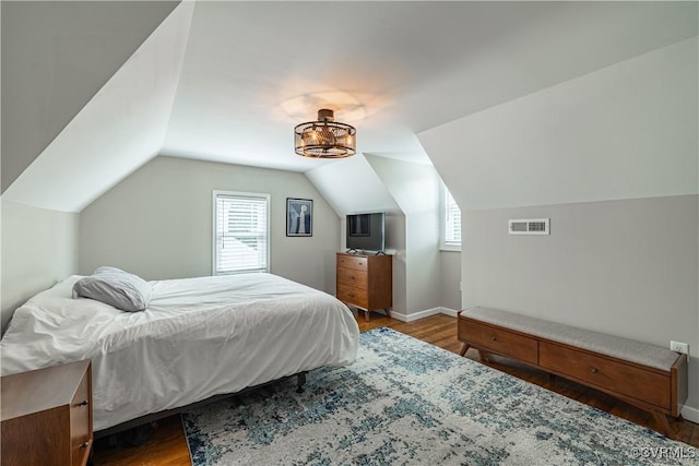 1815 Seddon Rd, Richmond, VA 23227 - bedroom with wood finished floors, multiple windows, and lofted ceiling