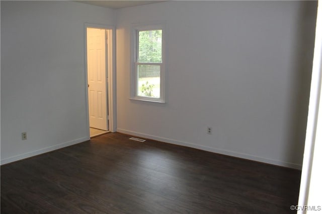 5041 Oakforest Dr, Chesterfield, VA 23832 - spare room with dark wood-type flooring and baseboards