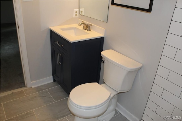 5041 Oakforest Dr, Chesterfield, VA 23832 - bathroom with vanity, toilet, and baseboards