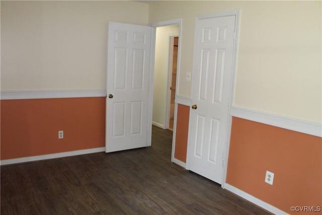 5041 Oakforest Dr, Chesterfield, VA 23832 - unfurnished bedroom with baseboards and dark wood-type flooring