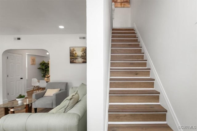 215 S S St, Petersburg, VA 23803 - staircase featuring arched walkways, recessed lighting, wood finished floors, and baseboards