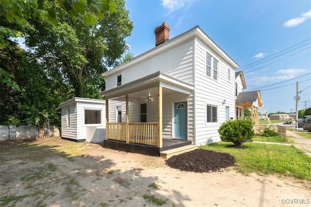 215 S S St, Petersburg, VA 23803 - view of front of house featuring a porch and a chimney