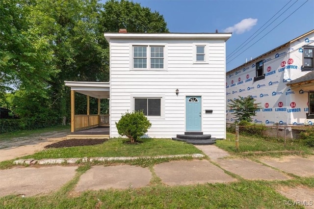215 S S St, Petersburg, VA 23803 - view of front facade featuring an attached carport