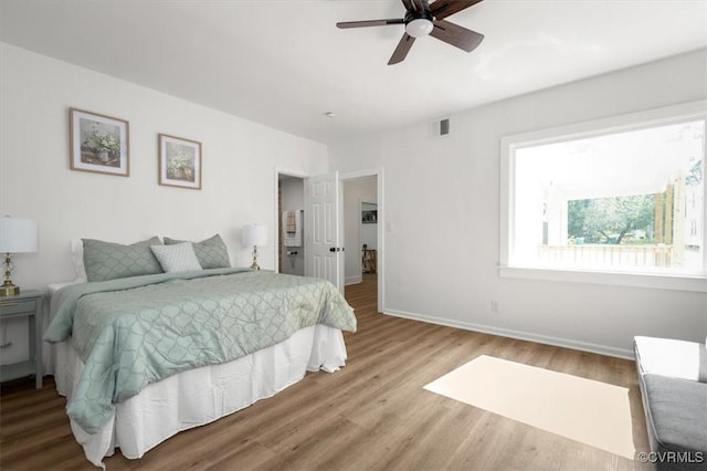 215 S S St, Petersburg, VA 23803 - bedroom featuring wood finished floors, baseboards, and ceiling fan