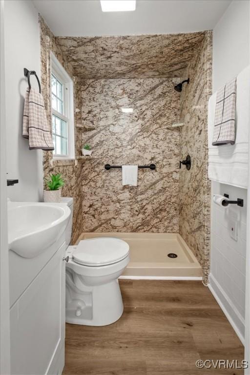 215 S S St, Petersburg, VA 23803 - full bathroom with a stall shower, vanity, toilet, and wood finished floors